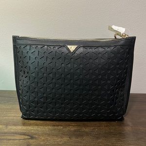 New never used Sam Edelman clutch, tag removed. In new condition. 10” x 7”.